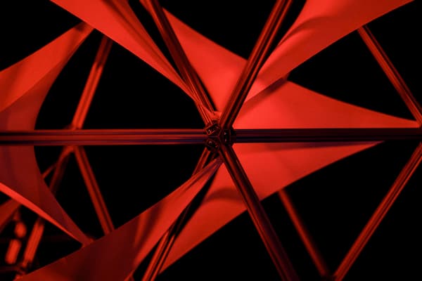 Abstract red geometric design with intersecting angular forms